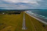 View of approach to the runway on a coastal airfield