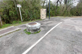 Water pump station cabinet at the end of a road
