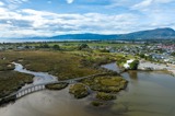 View over an estuary with mountains in the background