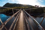 Person walking on a swingbridge