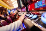 Hand on gambling machine