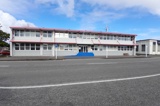 Two storey commercial building seen from across the street