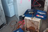 A household refrigerator being de-gassed in preparation for recycling